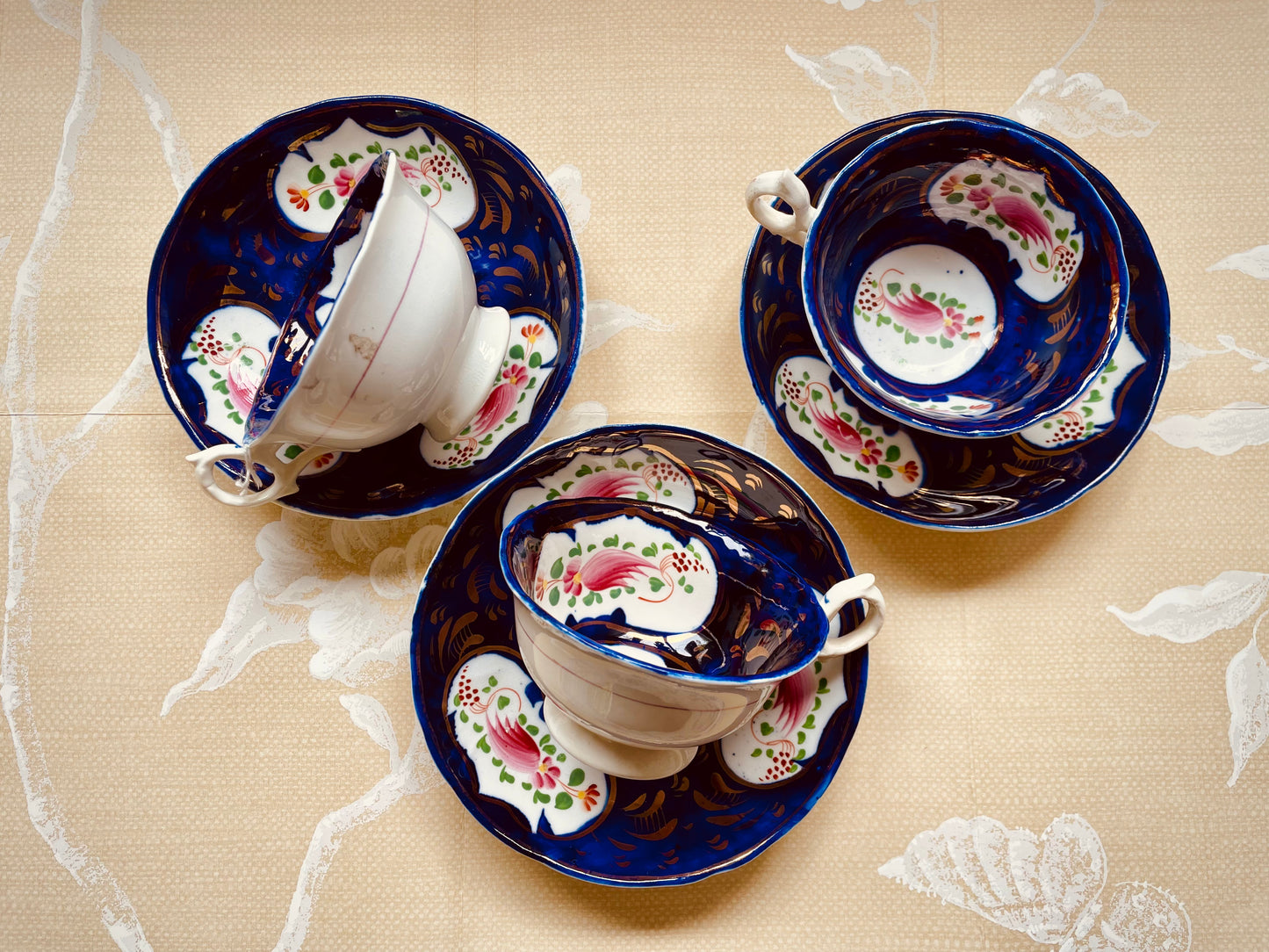 Three Antique Gaudy Welsh Cups and Saucers